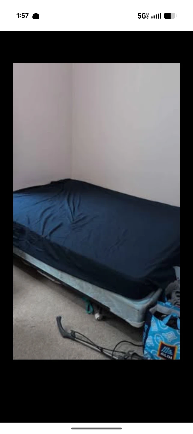 Twin Mattress with Dark Blue Sheet