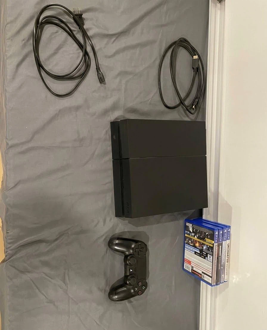 PlayStation 4 Console with Controller and Games