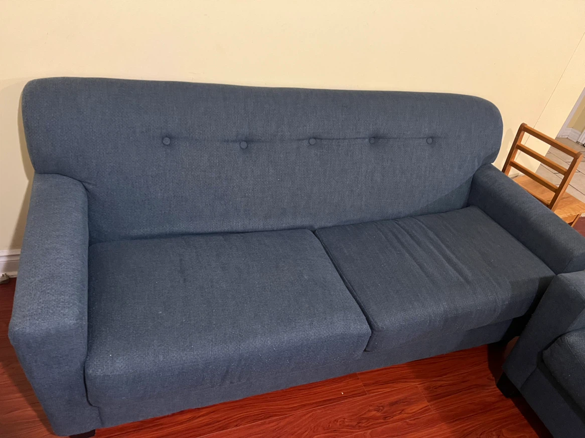 2 Grey couch with quilted covers