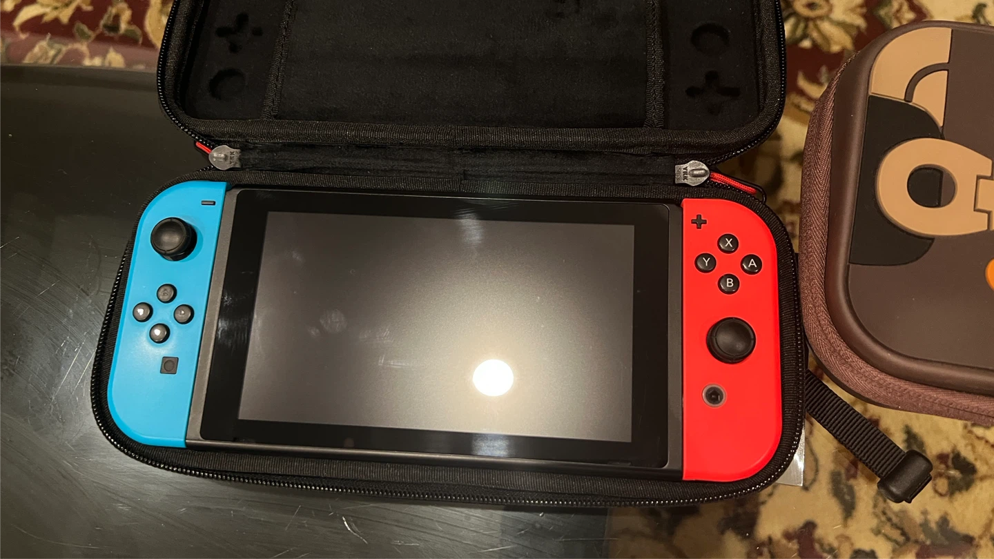 Nintendo Switch + 2 Carrying Cases and 128GB MicroSD Card