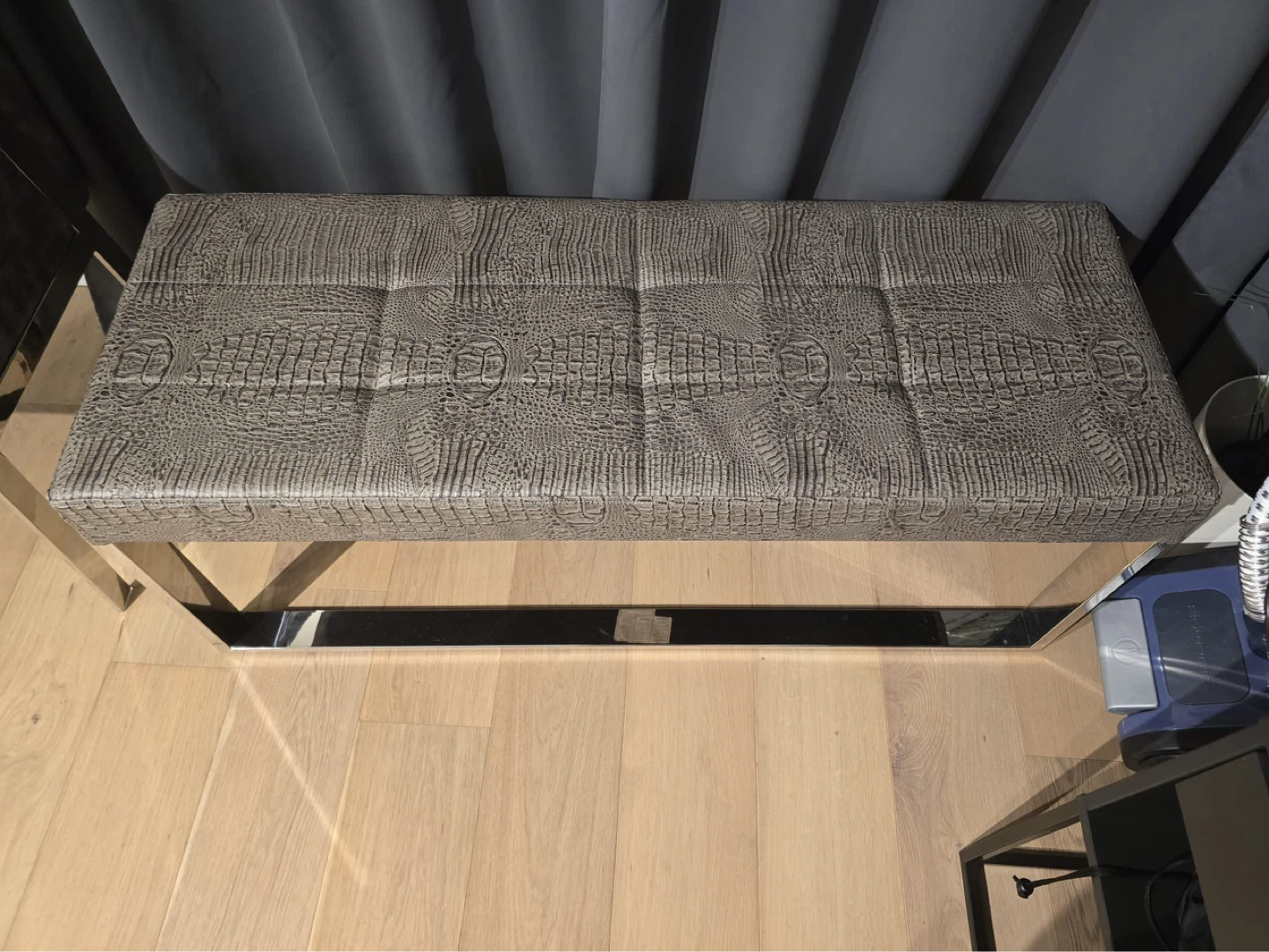 Faux crocodile bench with chrome legs