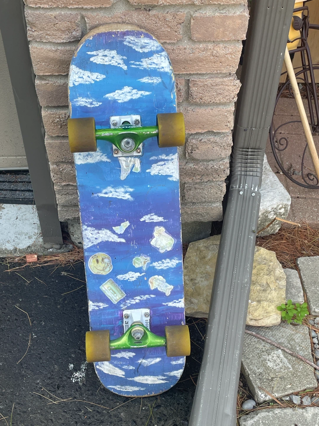 Skateboard with custom cloud design