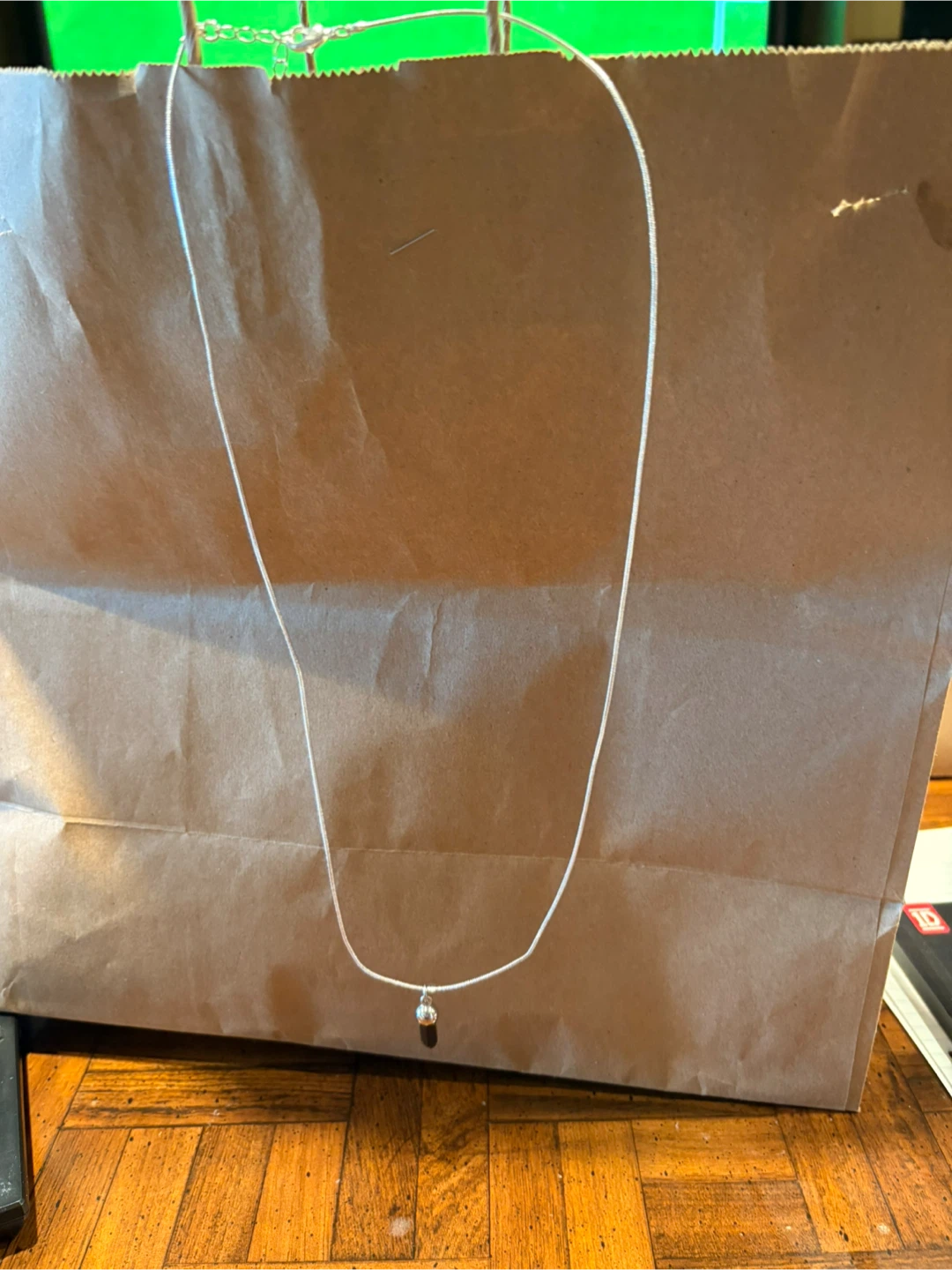 Silver necklace with ball pendant