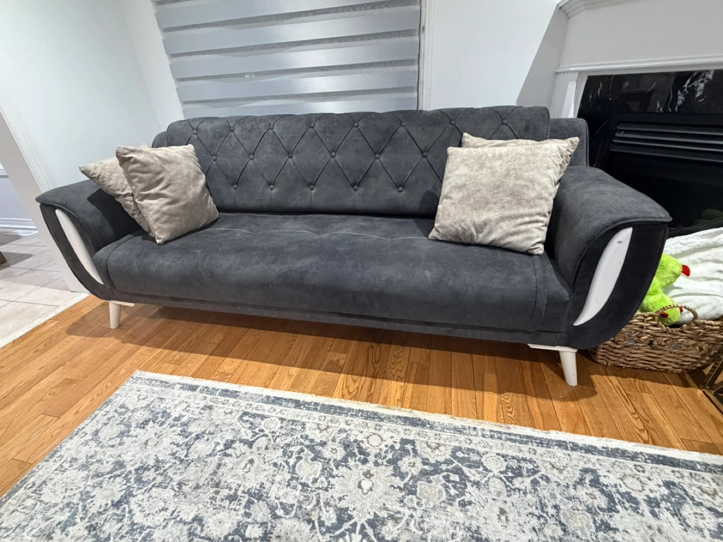 Dark Grey Tufted Sofa with Accent Pillows
