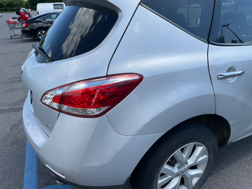 Silver Nissan SUV - photo 4
