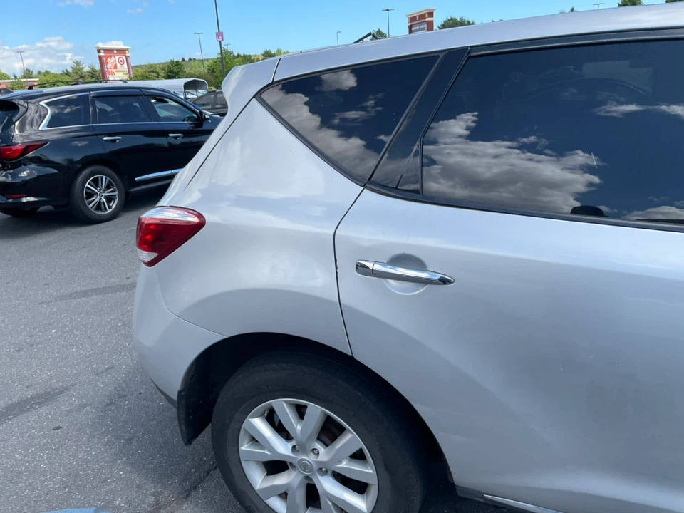 Silver Nissan SUV - photo 5