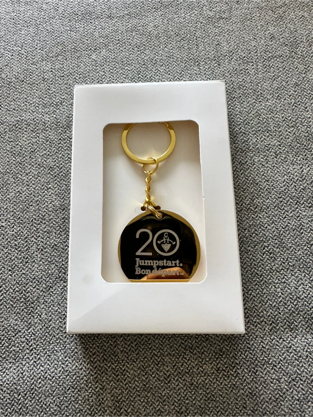 Jumpstart. Bon départ. 20th Anniversary Keychain