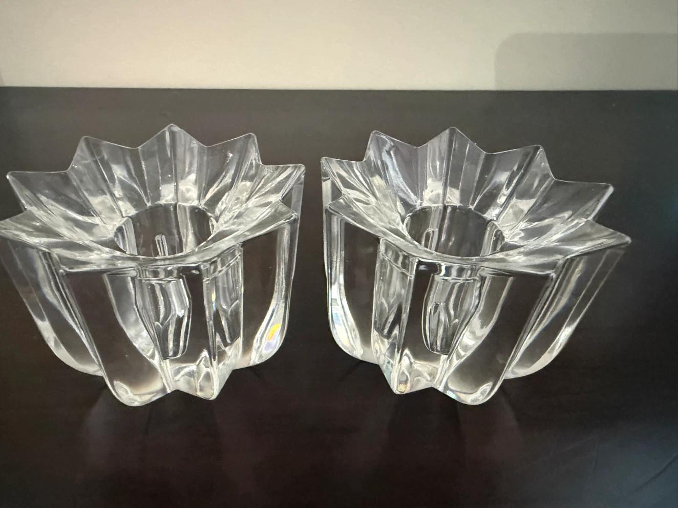Pair of clear glass star-shaped votive candle holders