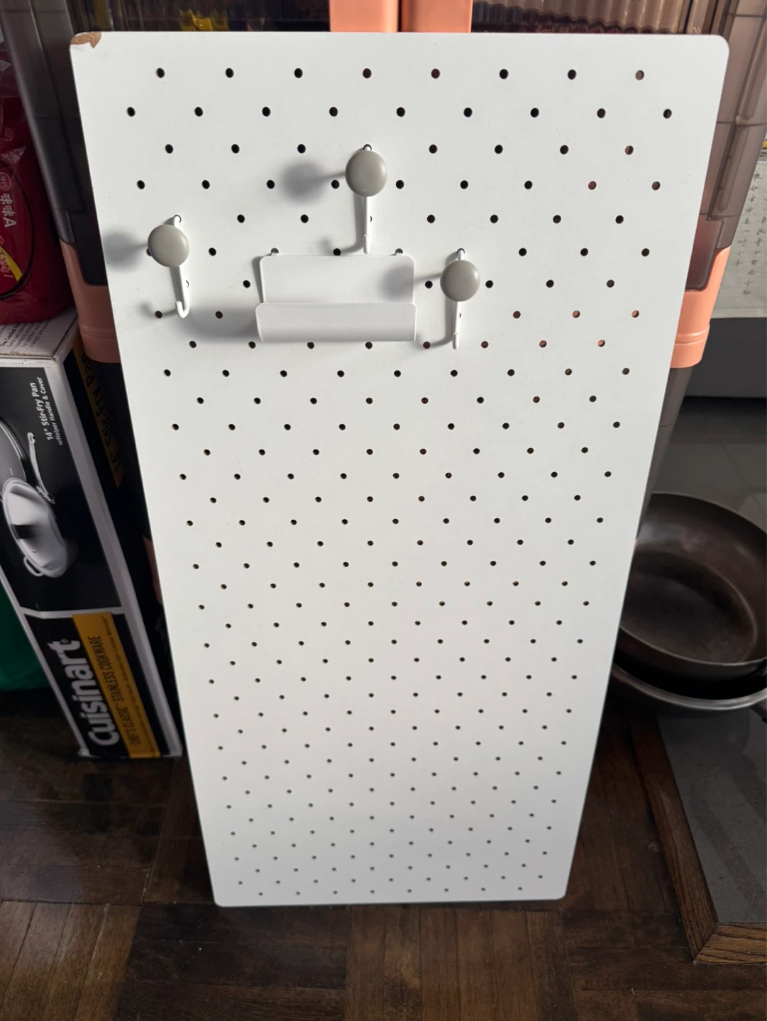 White Pegboard with Hooks and Holder