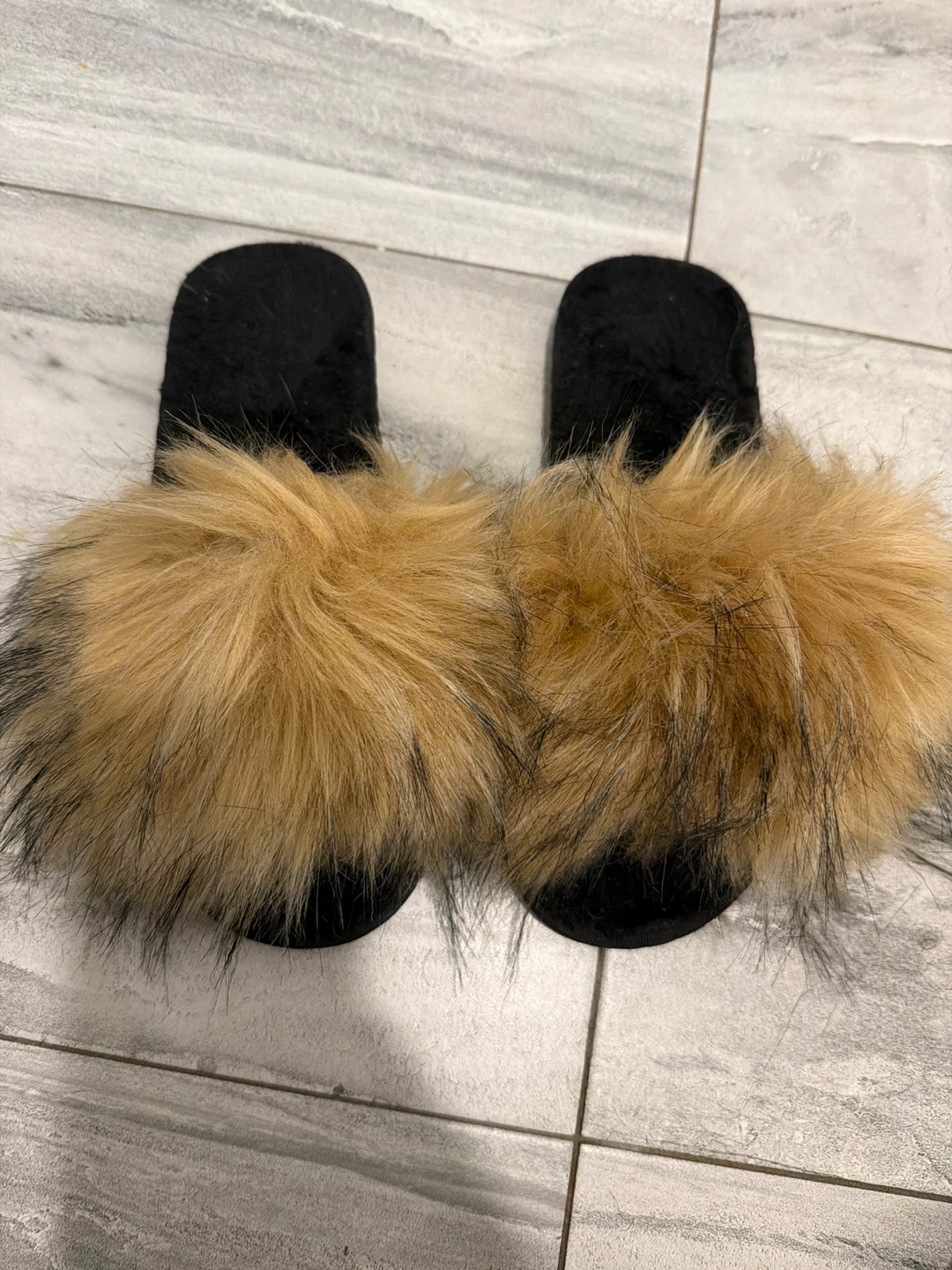 Black slides with tan faux fur