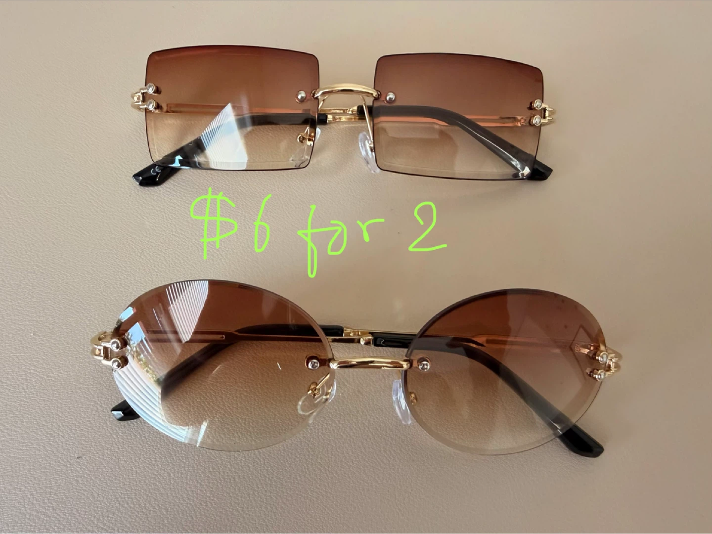 2 pairs of sunglasses, rimless rectangle and oval