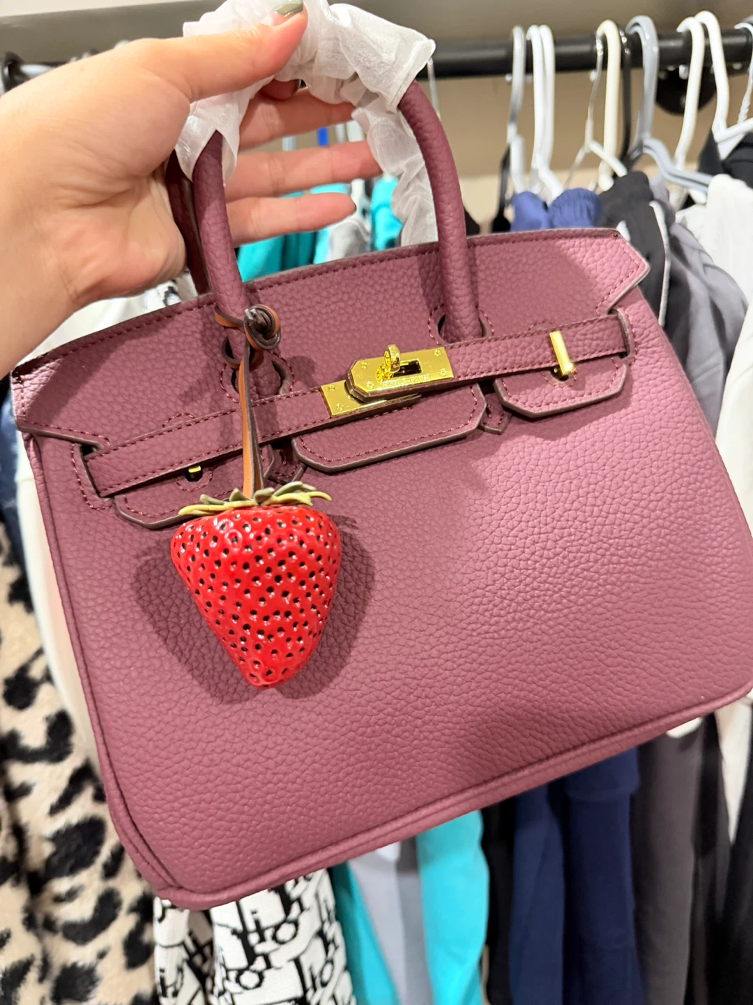 Structured handbag with strawberry charm