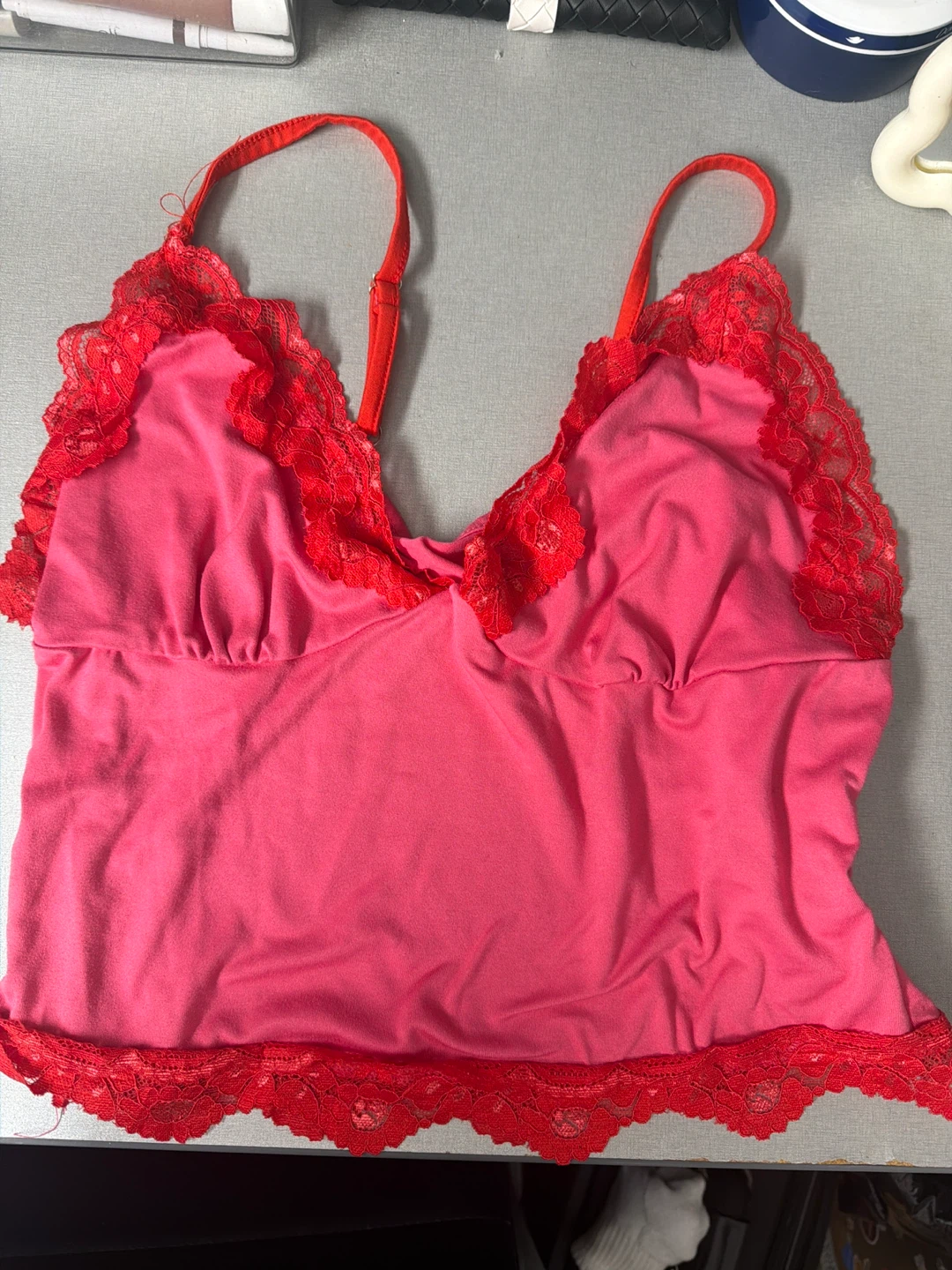 Pink camisole with red lace trim