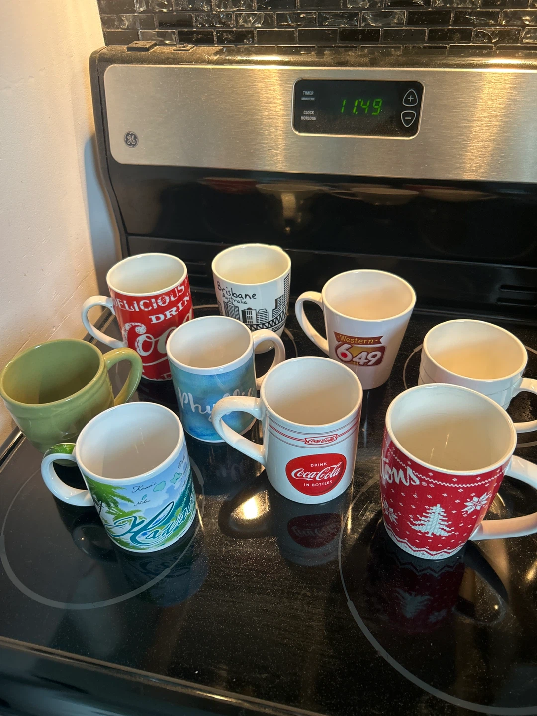 Collection of 9 assorted souvenir mugs