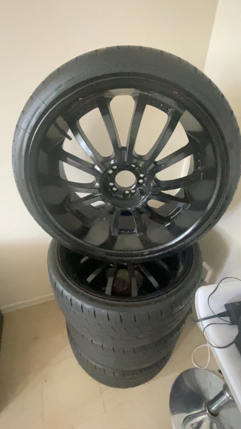 Set of 4 Black Aftermarket Rims and Tires