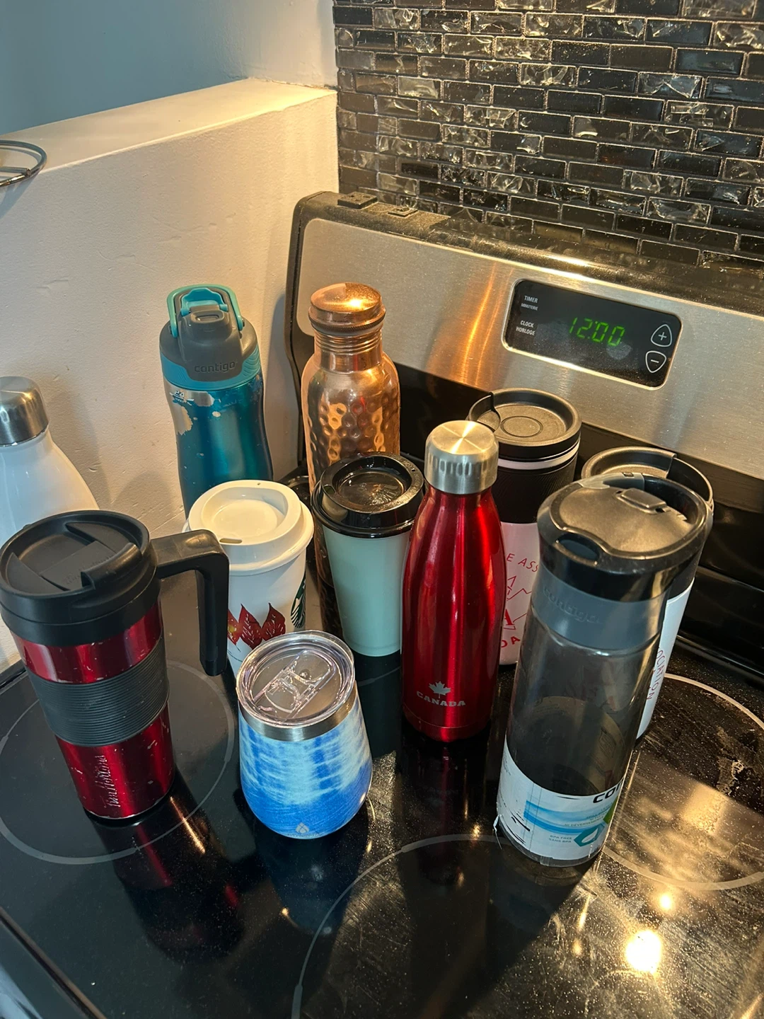 Assorted Reusable Water Bottles and Travel Mugs