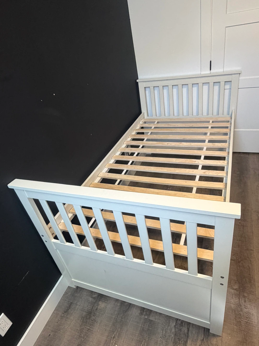 Twin bed frame in white wooden high rise