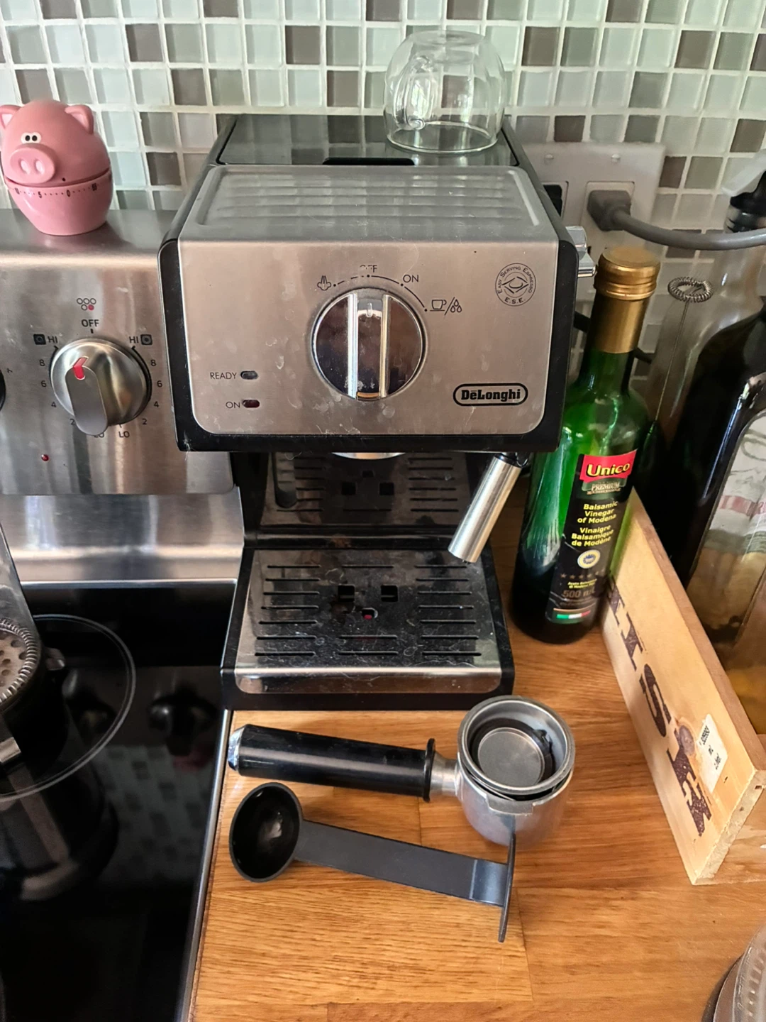 DeLonghi Espresso machine and bottle of descaler