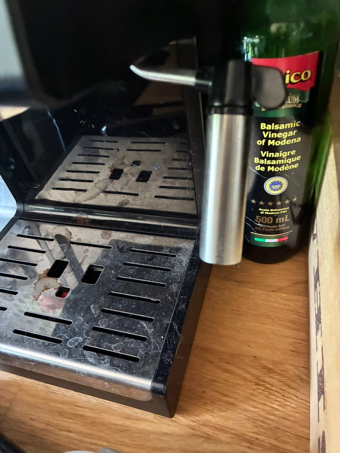 DeLonghi Espresso machine and bottle of descaler - photo 3