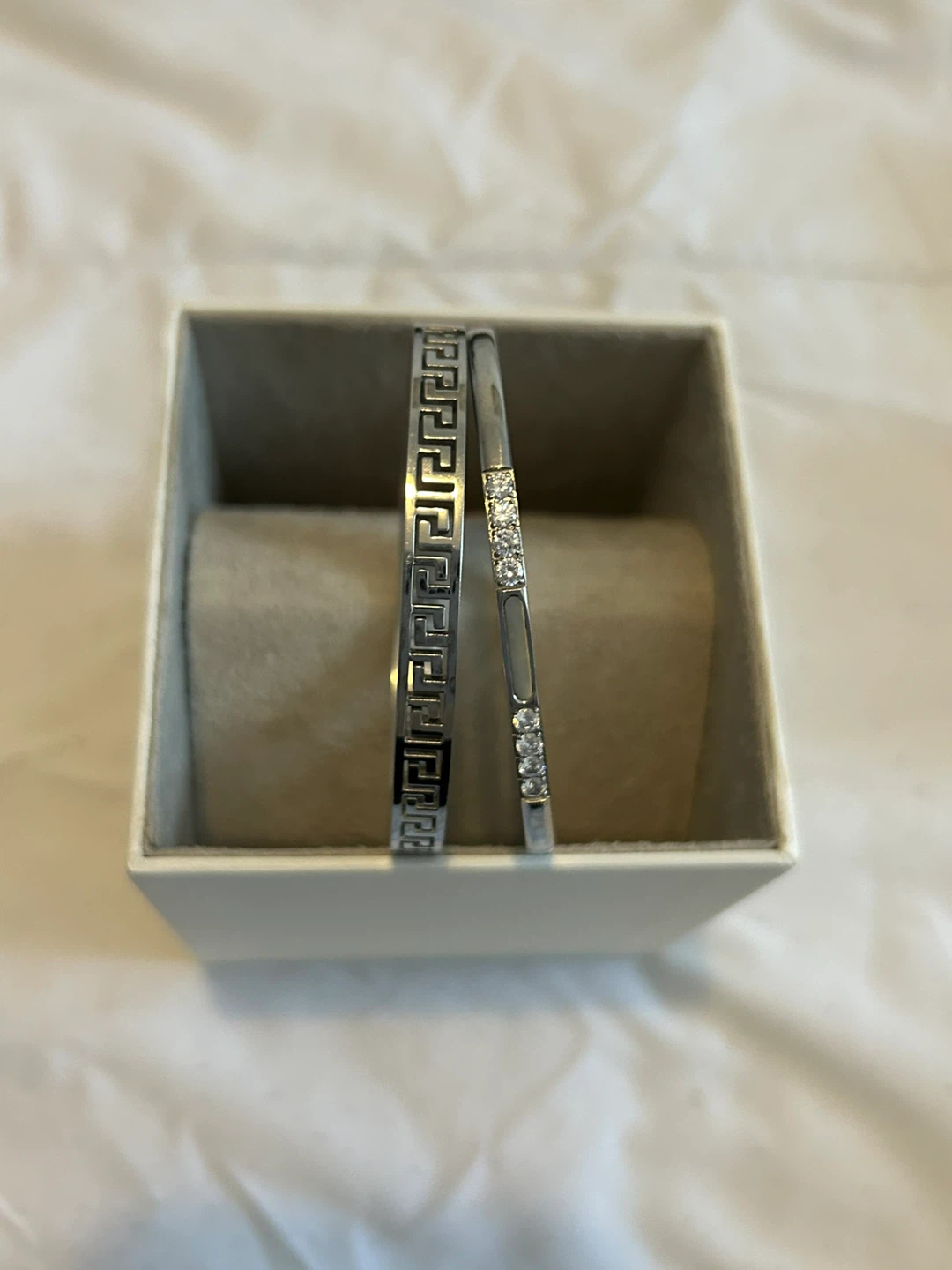 Silver-tone bangles with Greek key design and rhinestones