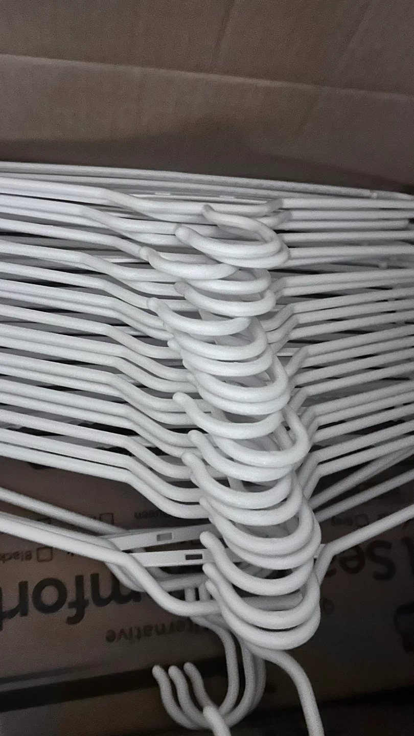 Stack of White Clothes Hangers
