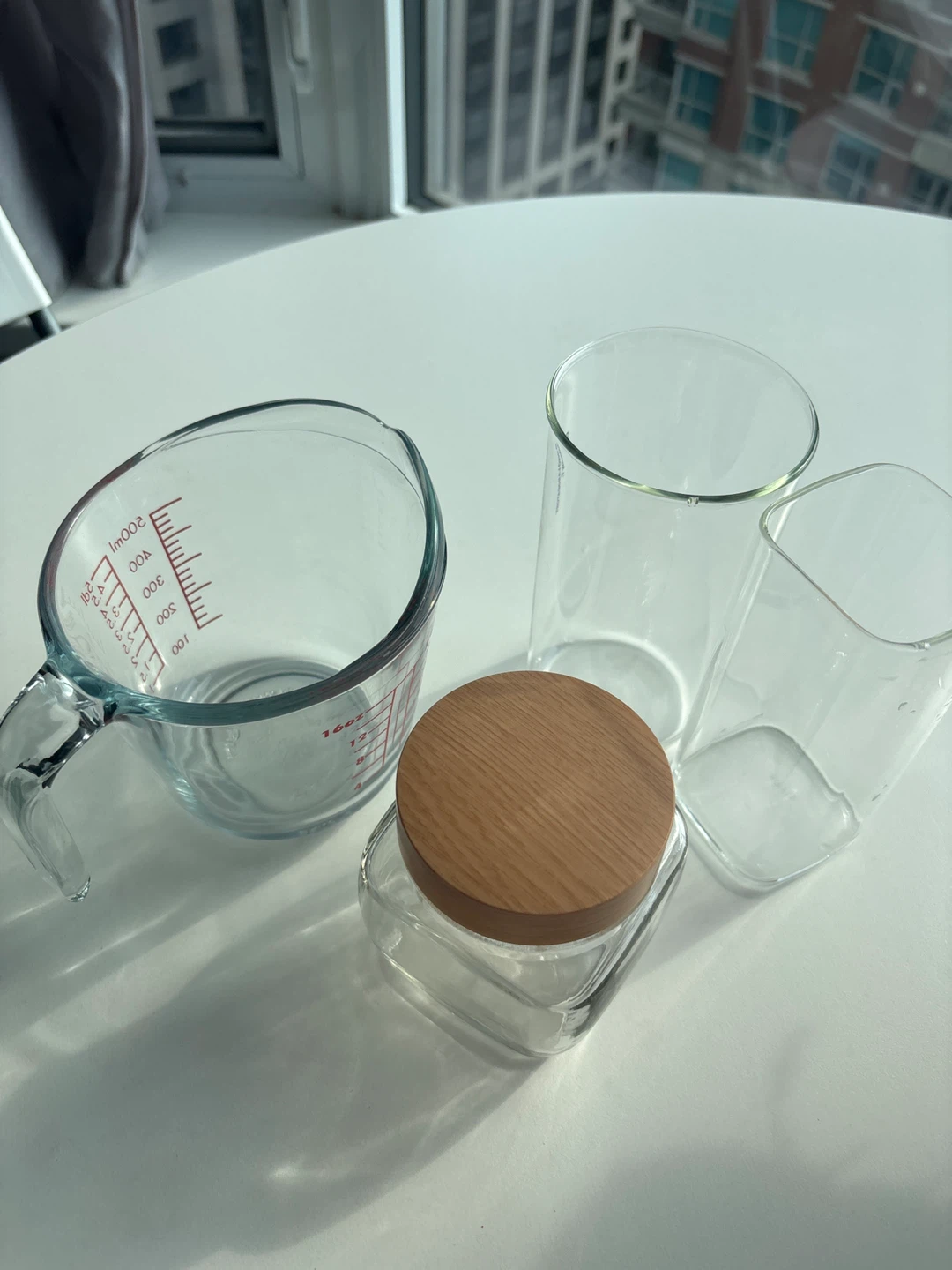 Glass measuring cup, jar, and two glasses