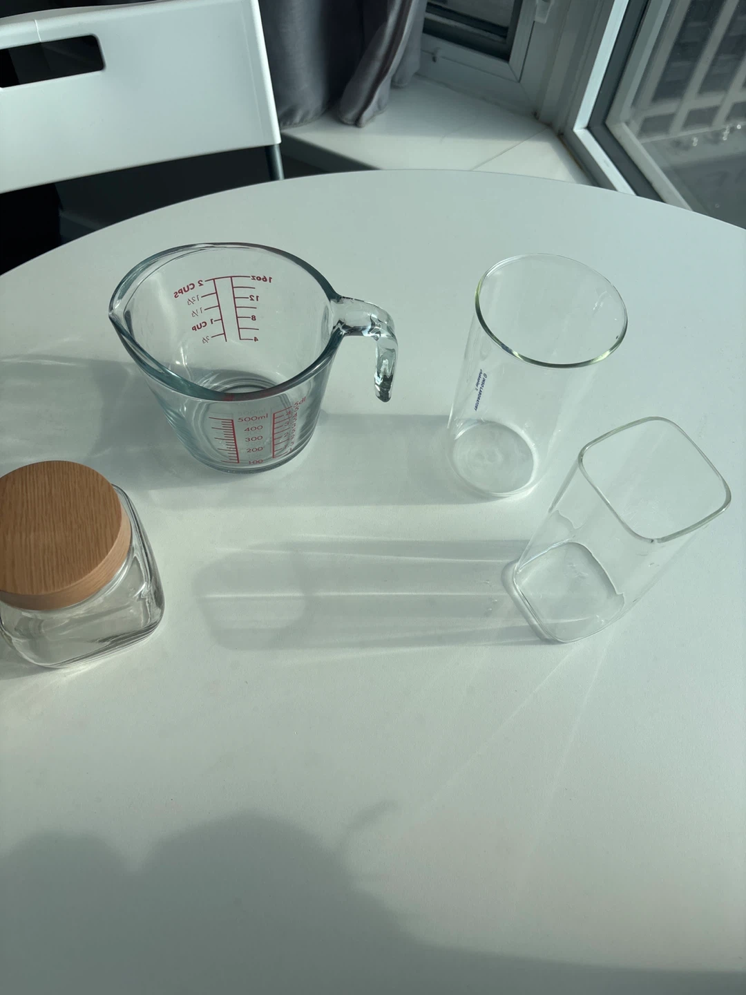 Glass measuring cup, jar, and two glasses - photo 2