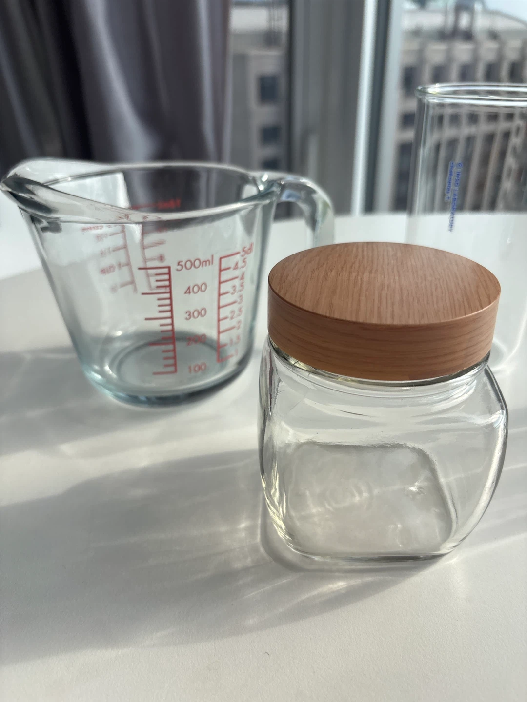 Glass measuring cup, jar, and two glasses - photo 4