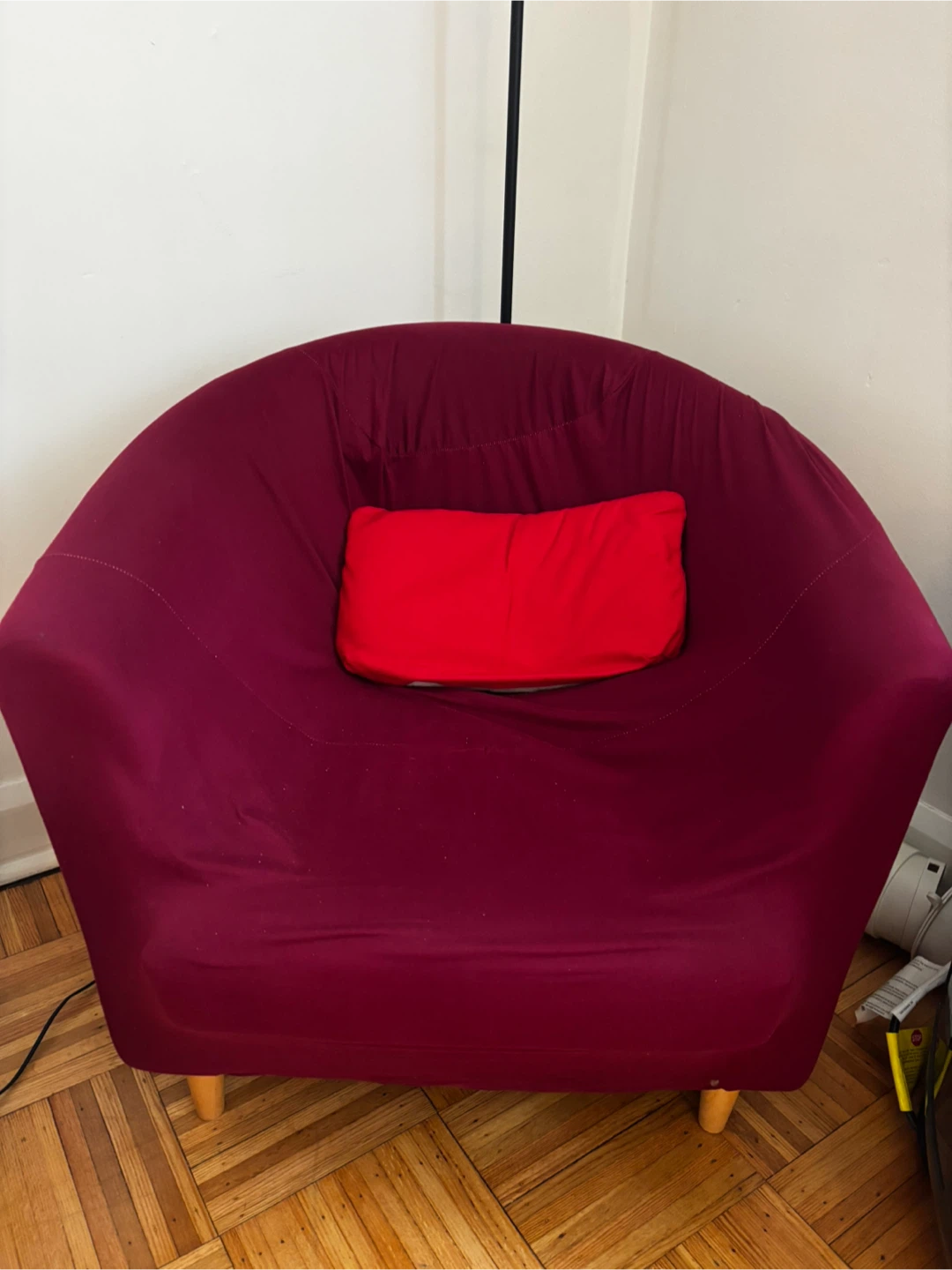 Maroon bean bag chair with red accent pillow