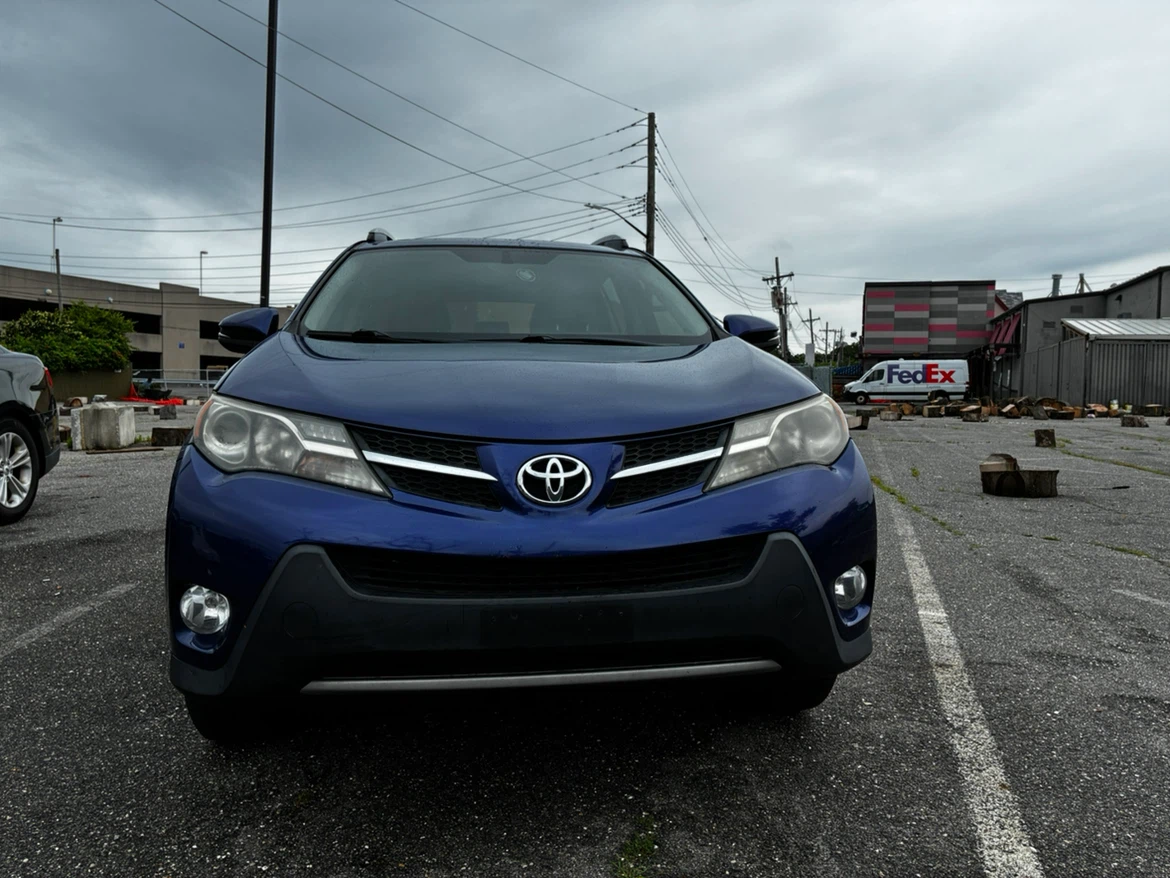 Blue Toyota RAV4 XLE AWD SUV