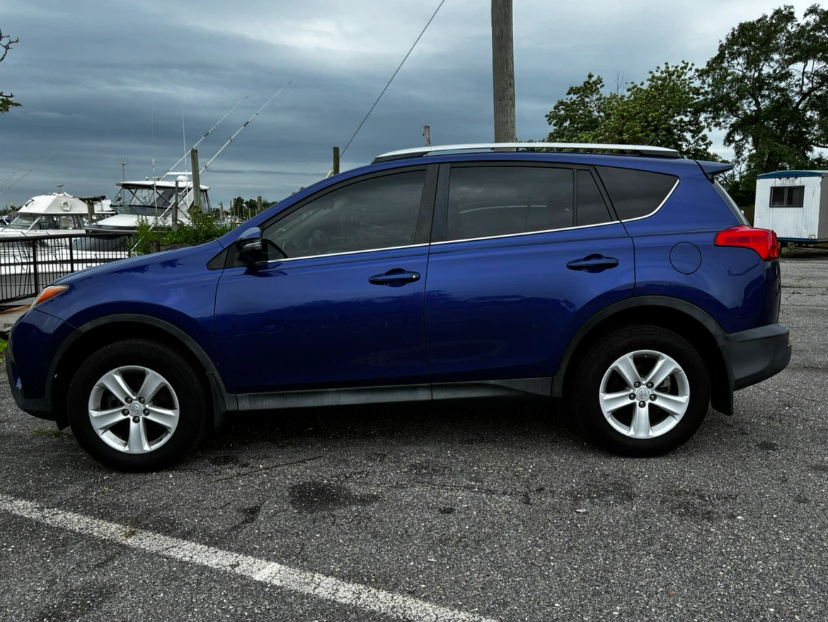 Blue Toyota RAV4 XLE AWD SUV - photo 3