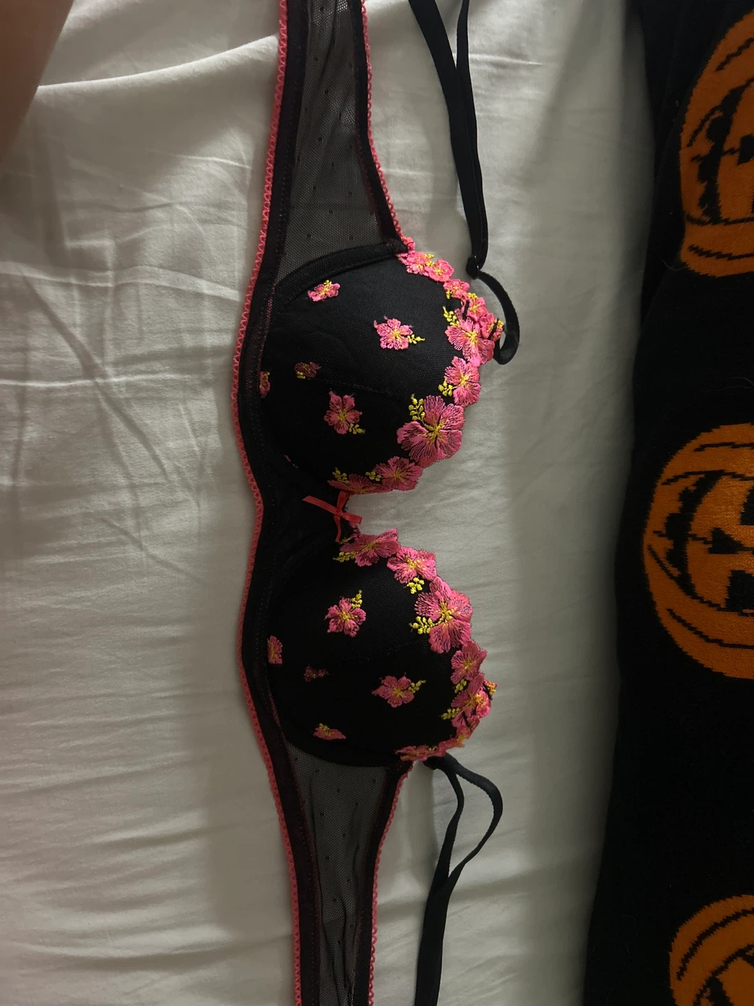 Black embroidered lace bra with pink trim