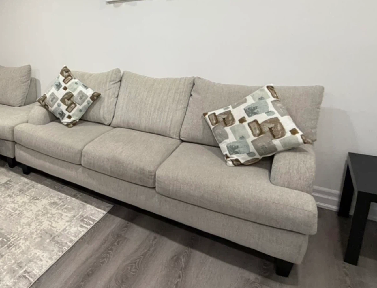 Beige Sectional Sofa with Decorative Pillows