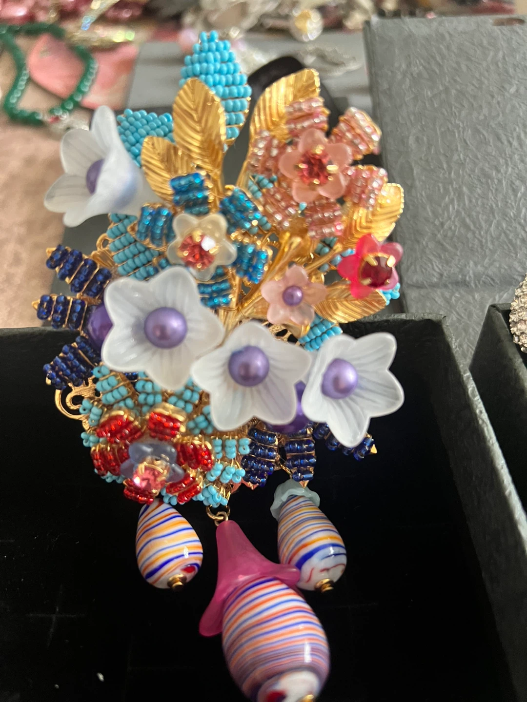 Gold-tone brooch with colourful charms