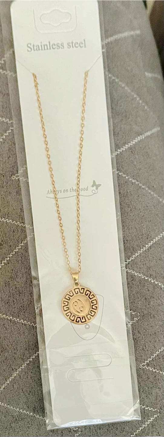 stainless steel necklace with a zodiac cancer sign pendant