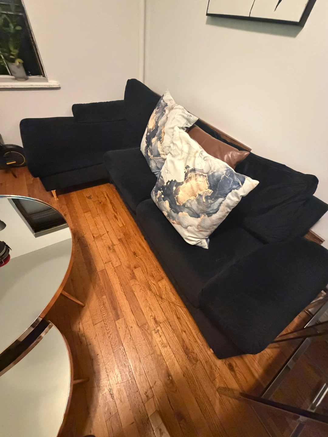 Black Sectional Sofa with coffee table and dining table