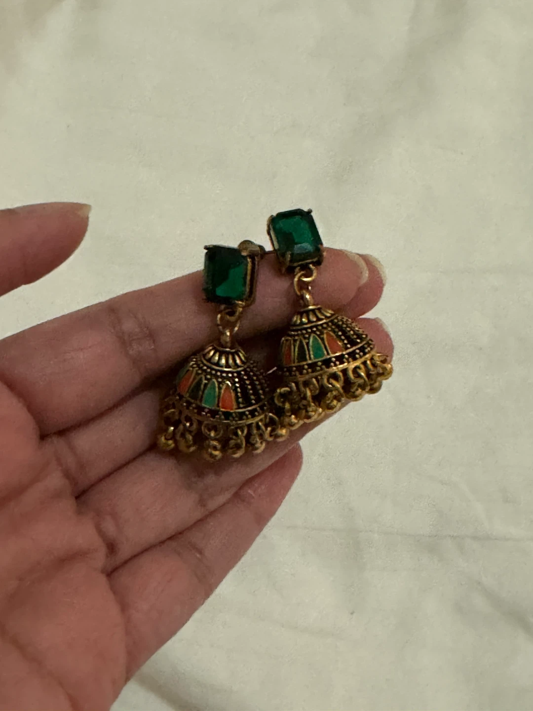 Gold-tone Jhumka Earrings with Green Gemstones
