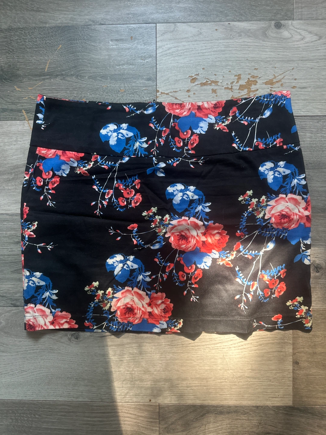 Black floral print mini skirt