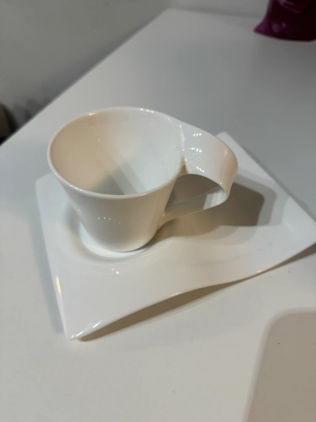 White Ceramic Cup and Saucer Set