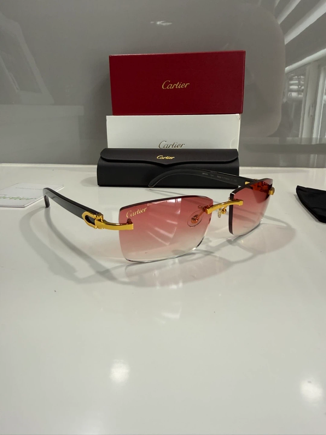 Cartier Rimless Sunglasses with Red Gradient Lenses