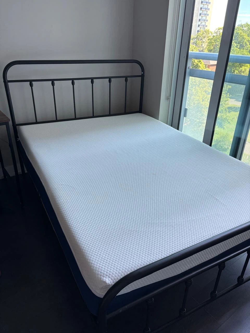 Black Metal Bed Frame with Mattress and pillows