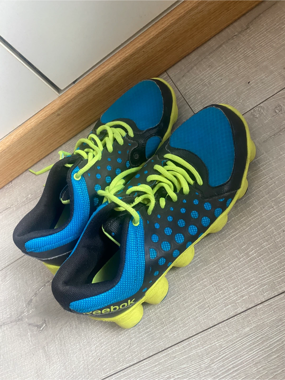 Reebok blue and yellow running shoes