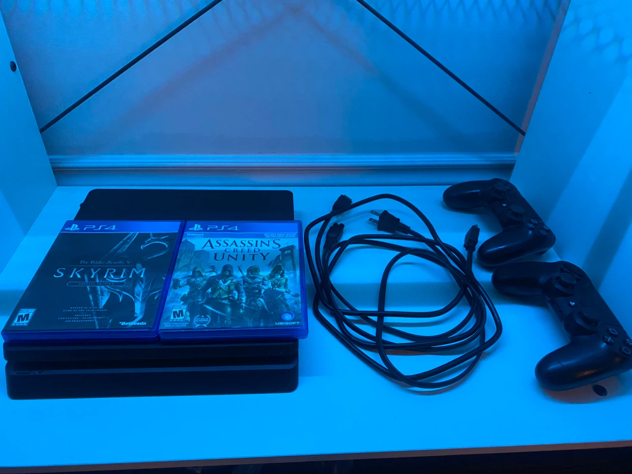 Sony PlayStation 4 Pro Console with Games and Controllers