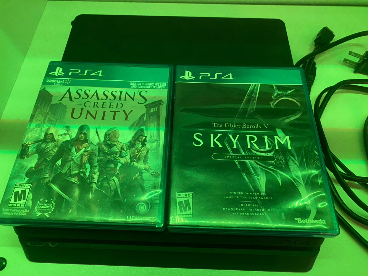 Sony PlayStation 4 Console with Two Games and Controllers - photo 2