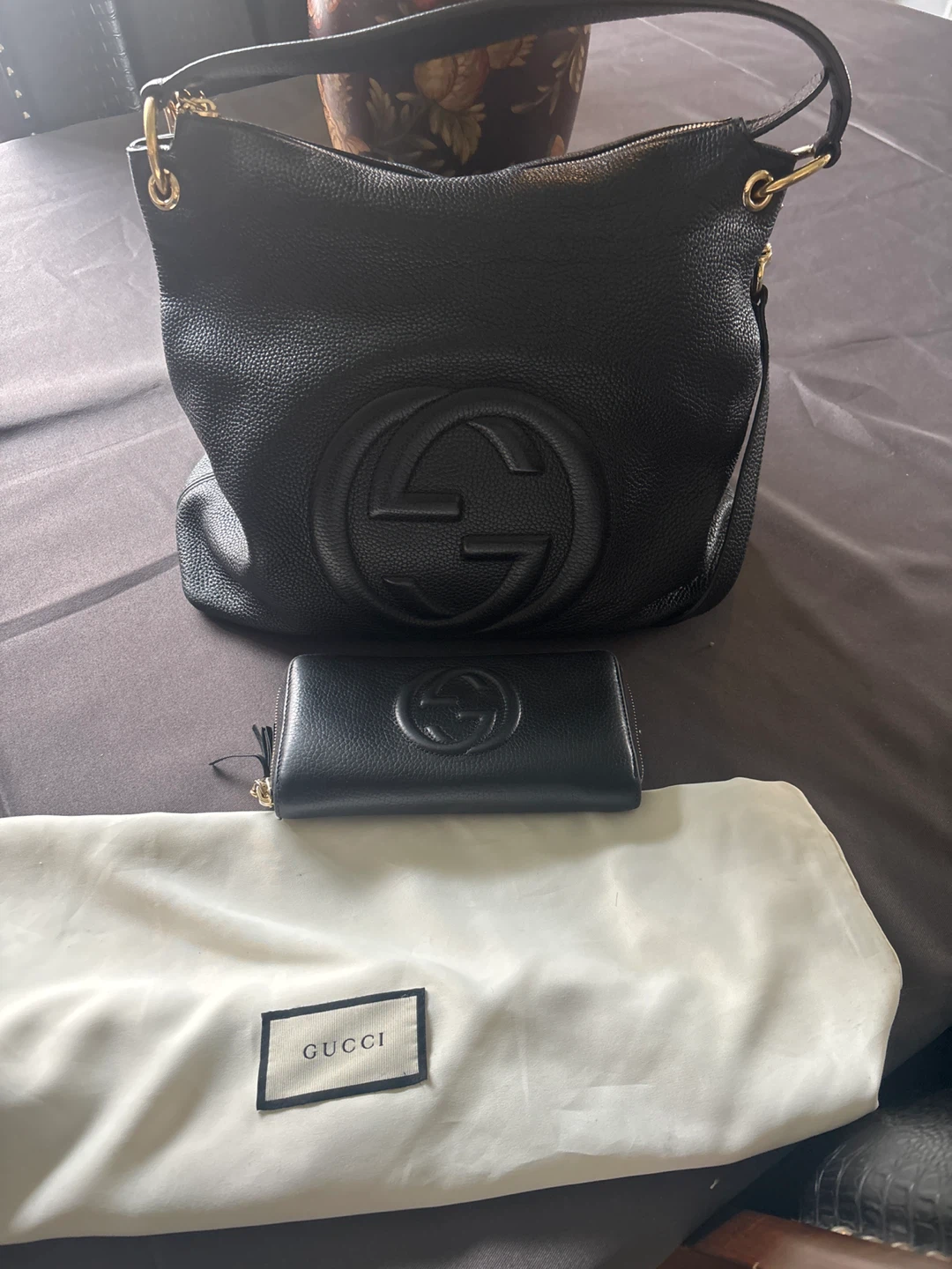 Gucci, black leather purse