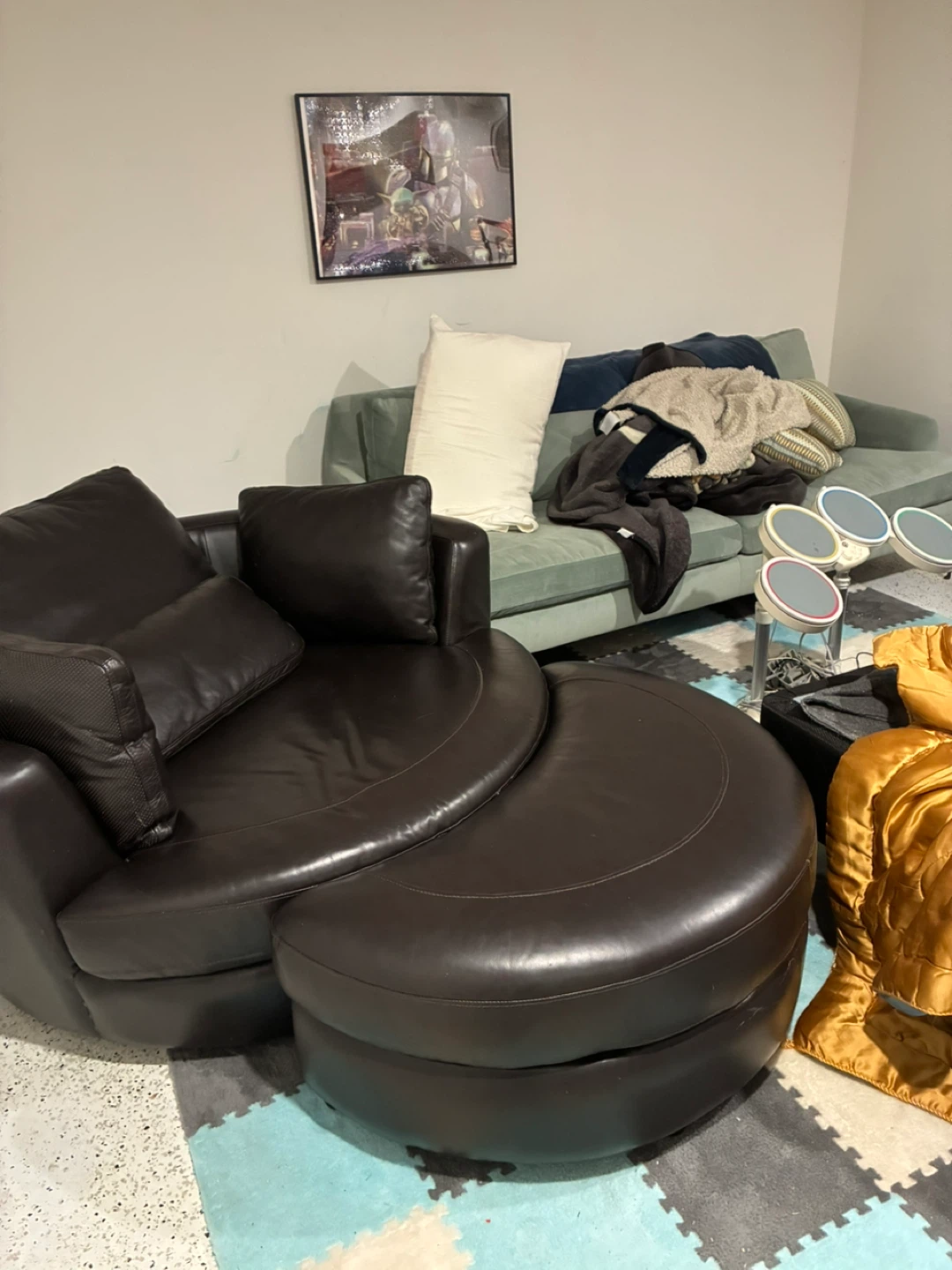 Brown leather swivel chair with ottoman