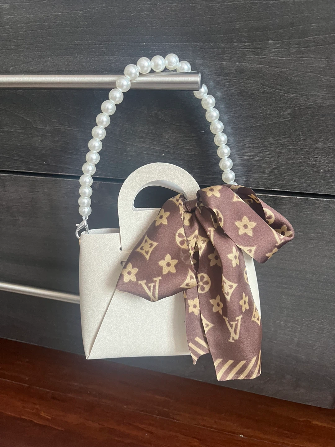 White structured mini bag with pearl handle and printed scarf