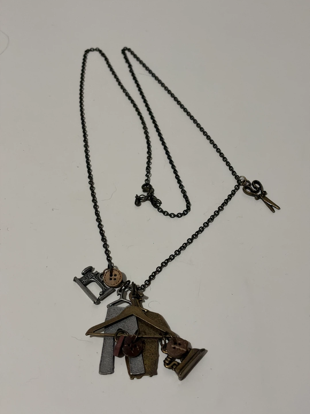 Sewing themed pendant necklace