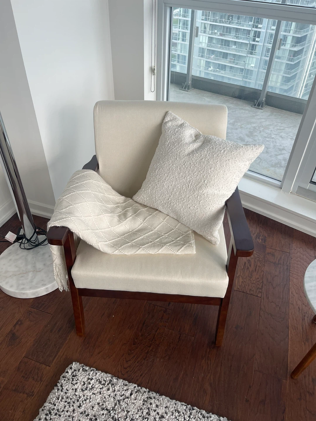 Cream Upholstered Armchair with Dark Wood Frame