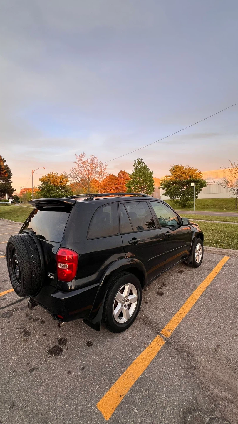 Black Toyota RAV4 Limited SUV - photo 3